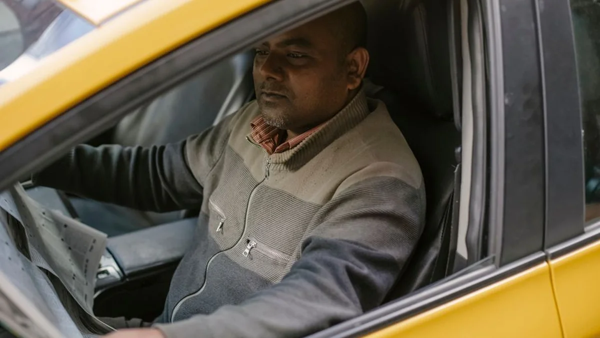 In the driver’s seat and trunk of a Georgian car there are six Africans